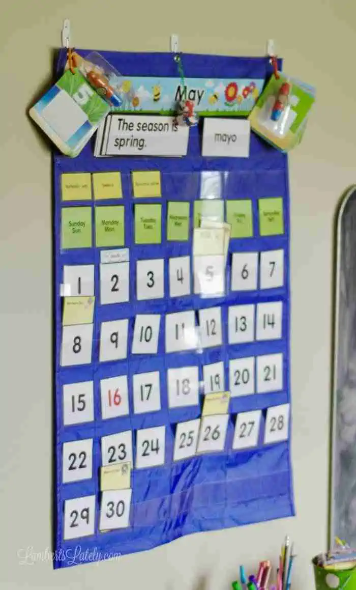 blue pocket calendar hanging on a wall.