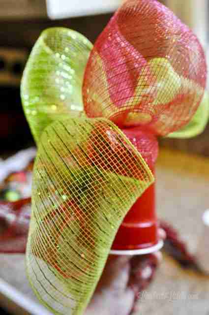 glue deco mesh ribbons all around plastic cup