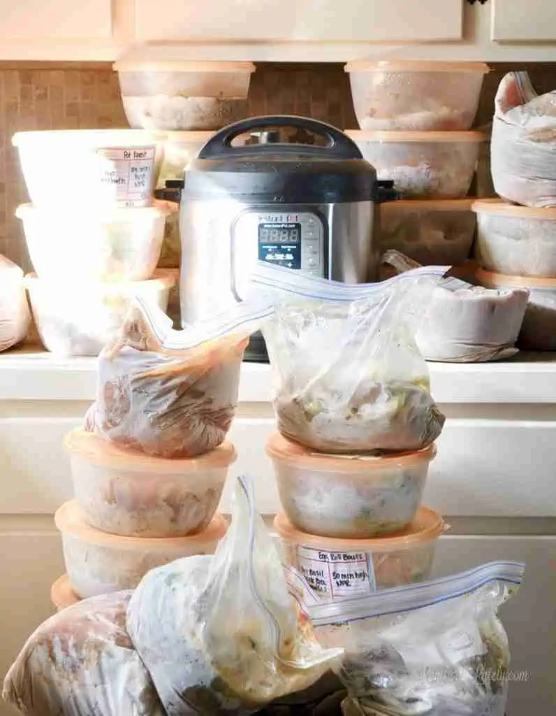 instant pot on a counter surrounded by freezer meals.