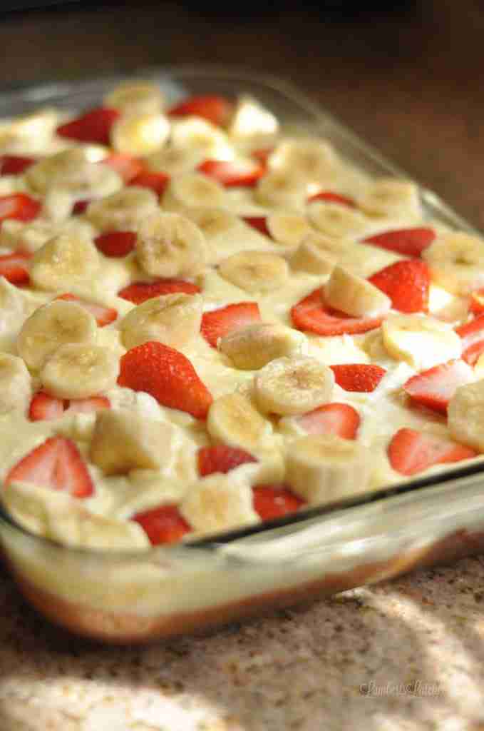 This recipe for Strawberry Banana Poke Cake is an easy recipe made with rich banana pudding and fresh strawberries.