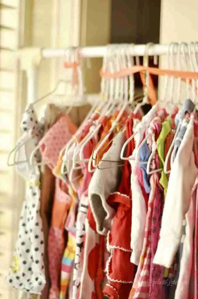 children\'s clothing on a rack.