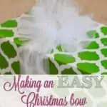making an easy christmas bow, green wrapping paper with tulle ribbon.