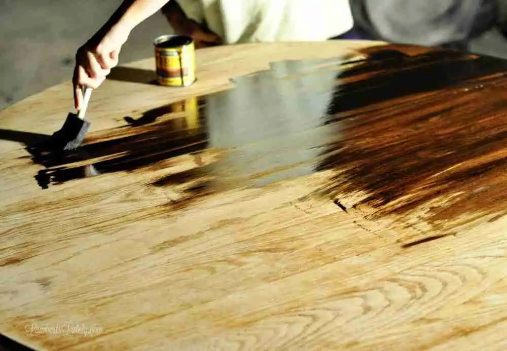 staining the top of a table.