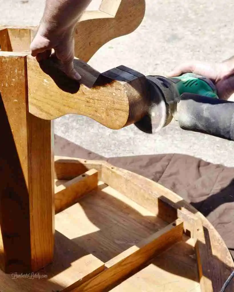 sanding the legs of a table.