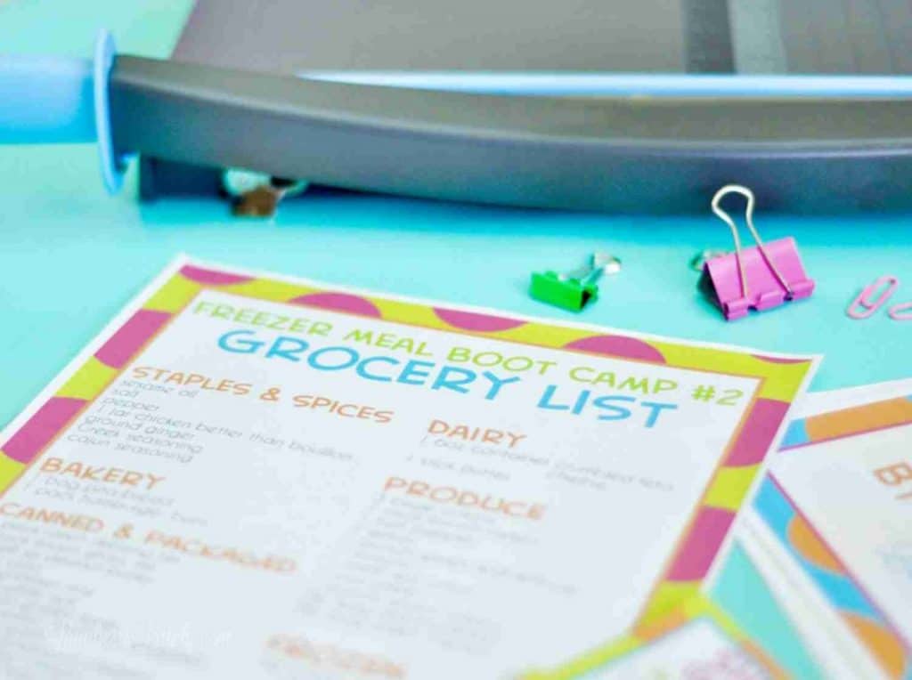 freezer meal grocery list printable on a blue background.