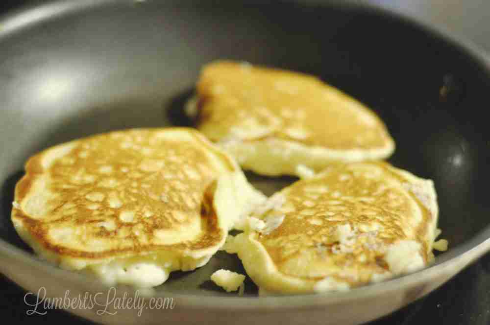 pancakes cooking in a pan.