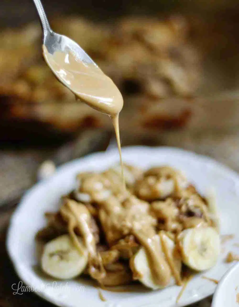 drizzling peanut butter sauce over monkey french toast casserole.