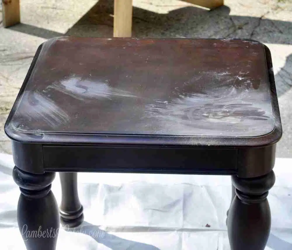 sanded parts of a wood table.