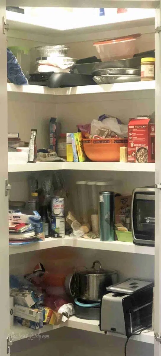 unorganized food on pantry shelves.