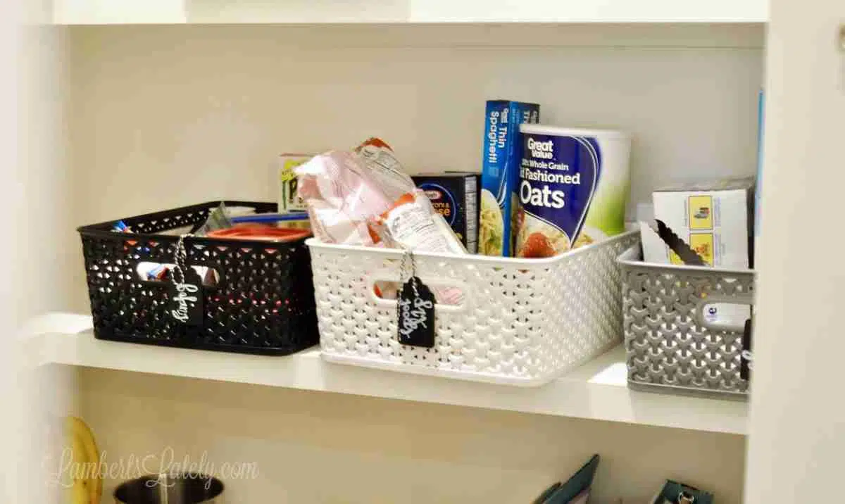 plastic bins on a pantry shelf.