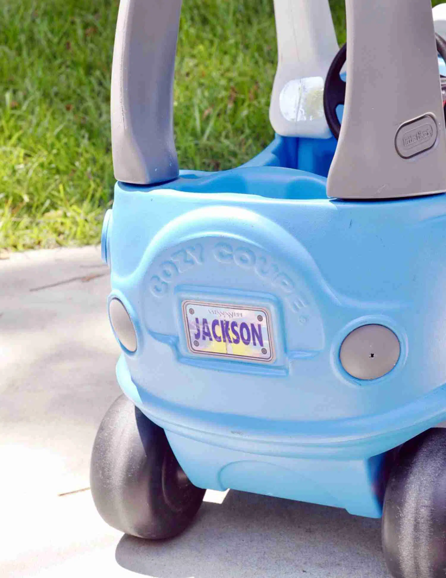 back of cozy coupe with personalized license sticker.