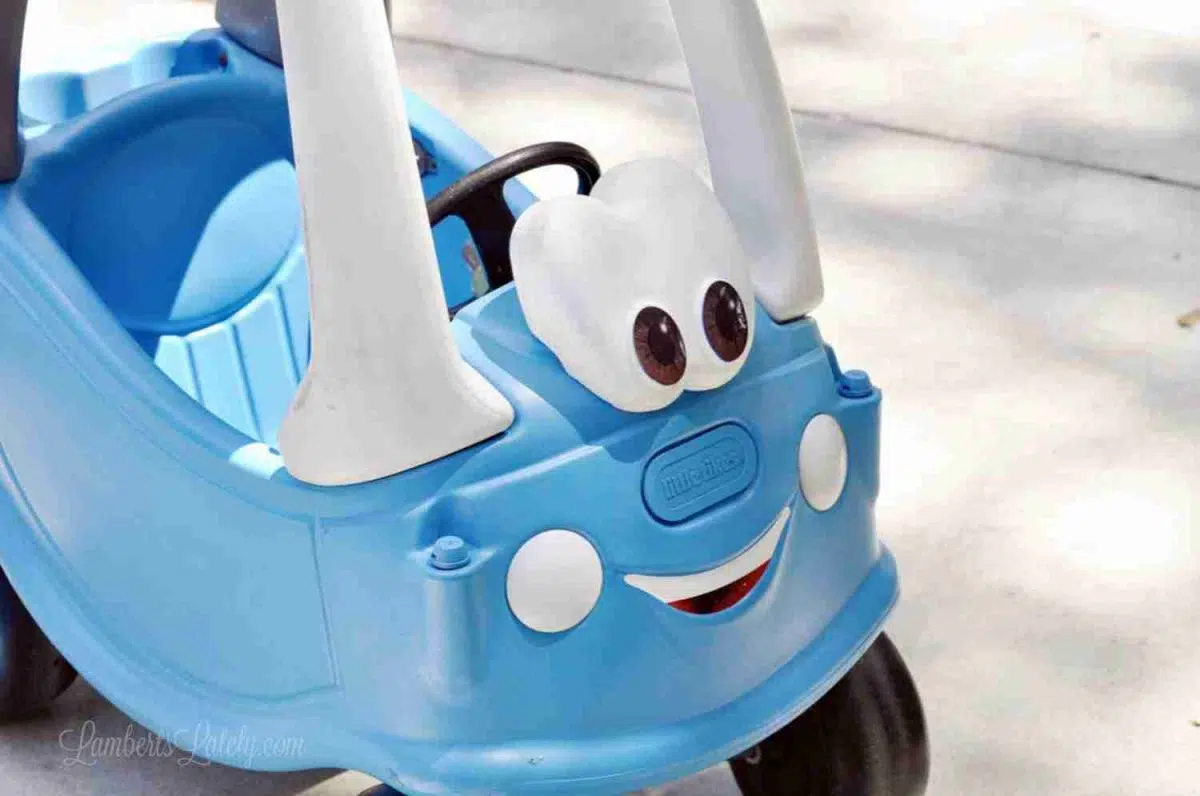 front of cozy coupe after painting blue.