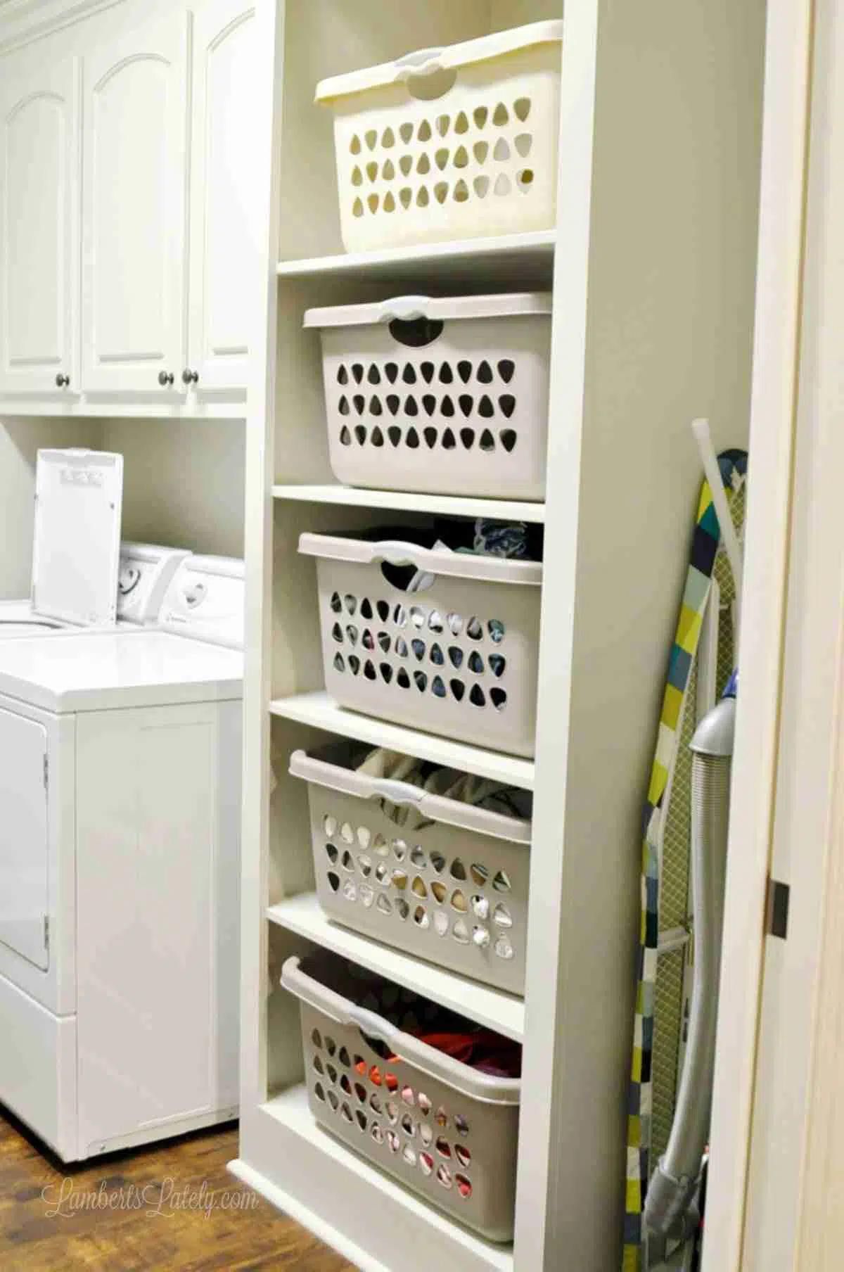 stacking laundry basket built in cabinet.