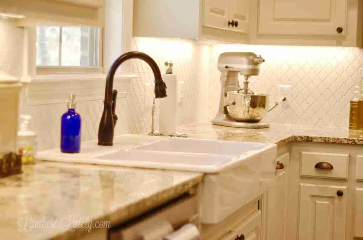 kitchen counter, sink, stand mixer in the background.