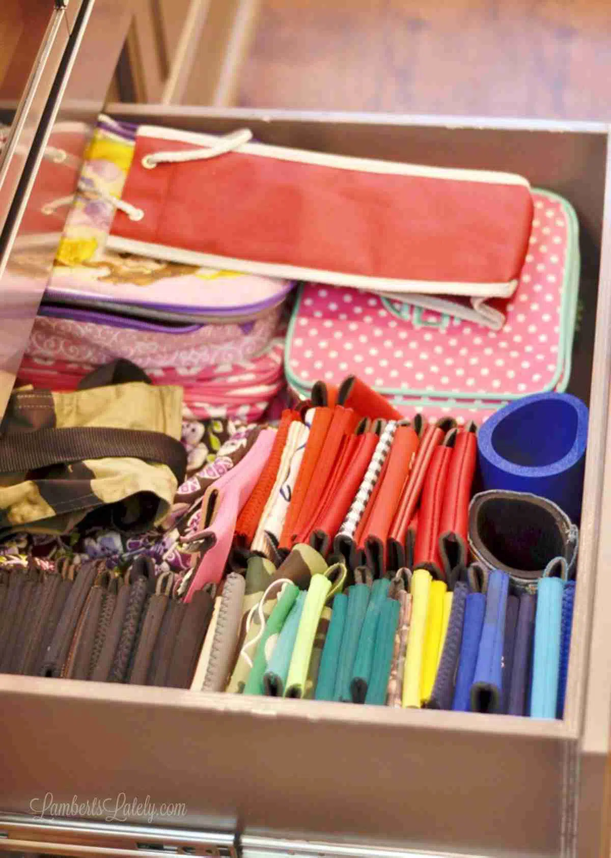 drawer with koozies filed in color order.