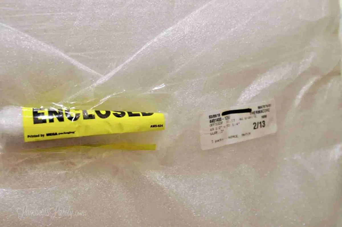 shutter hardware packaged in bright yellow packaging.