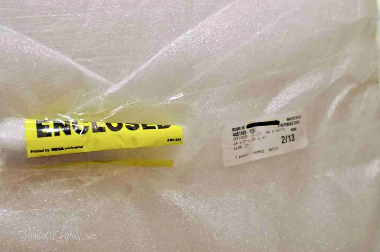 shutter hardware packaged in bright yellow packaging.