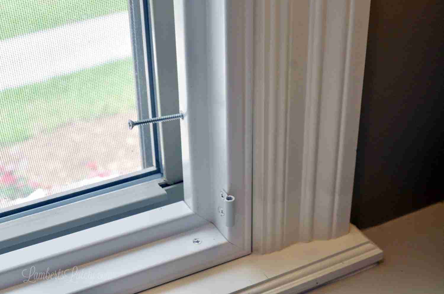 shutter frame in window sill with screw hanging out.