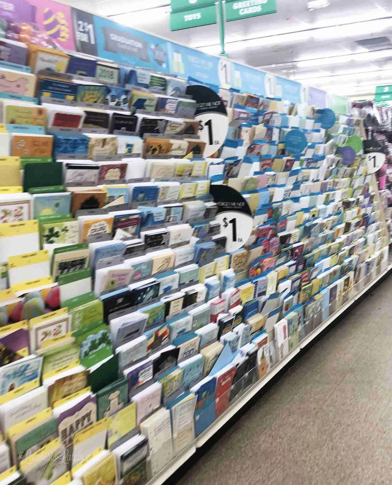 greeting cards on shelf at dollar tree.