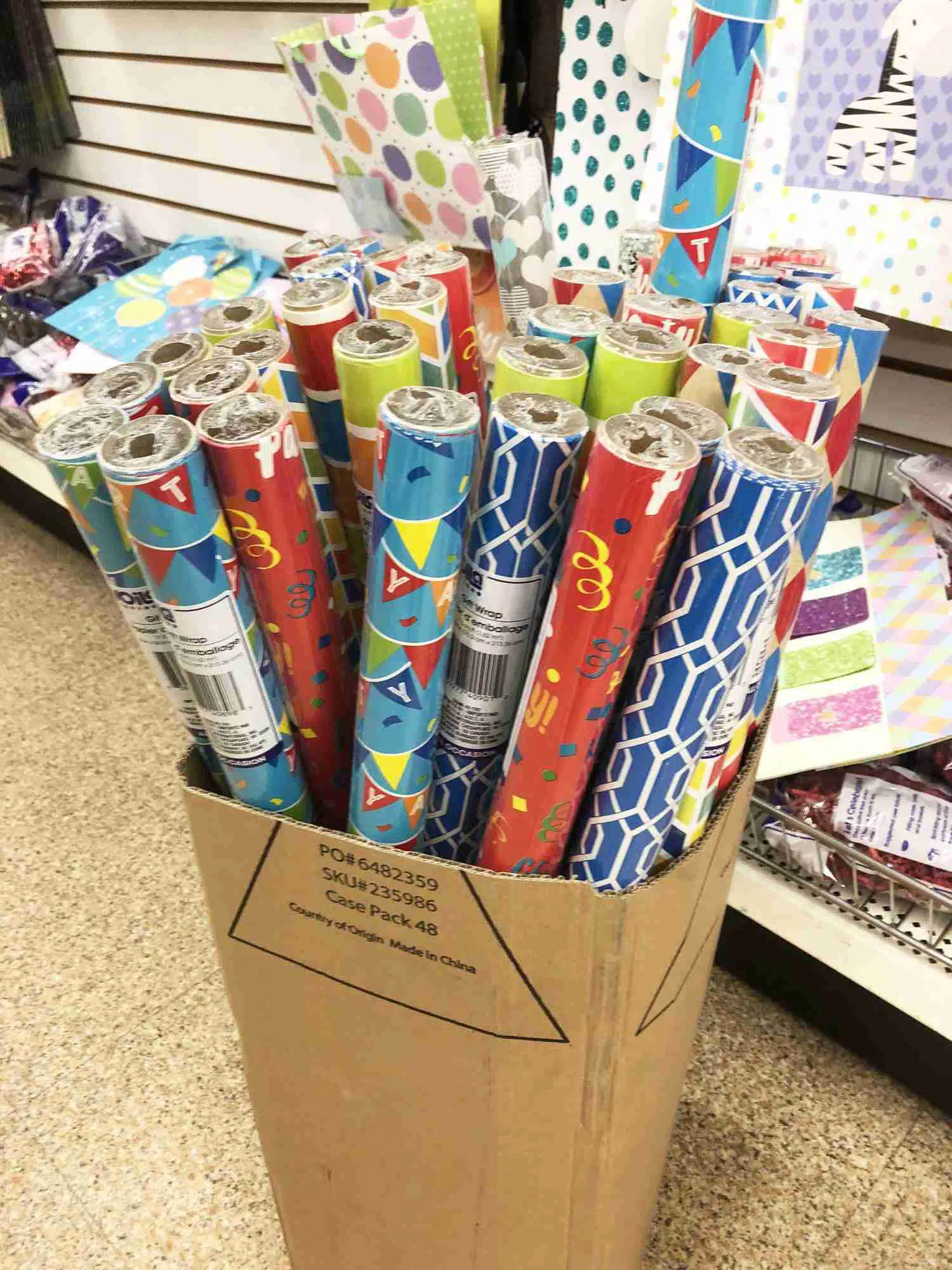 wrapping paper rolls in a cardboard box.