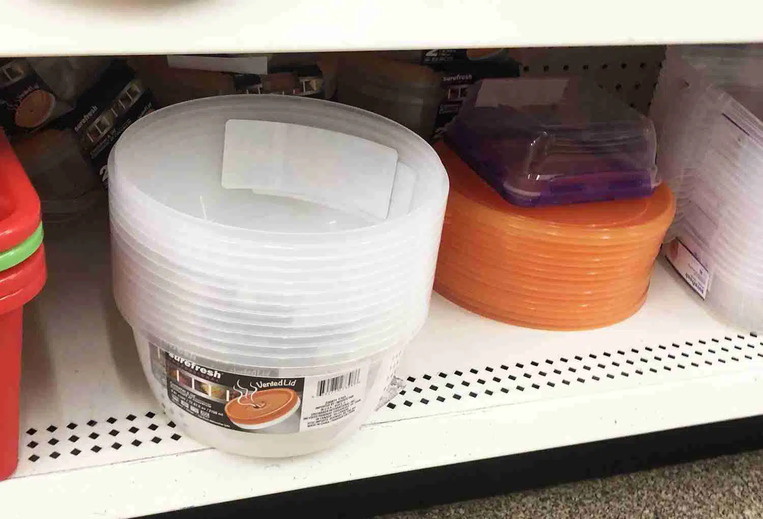 plastic containers on a store shelf.