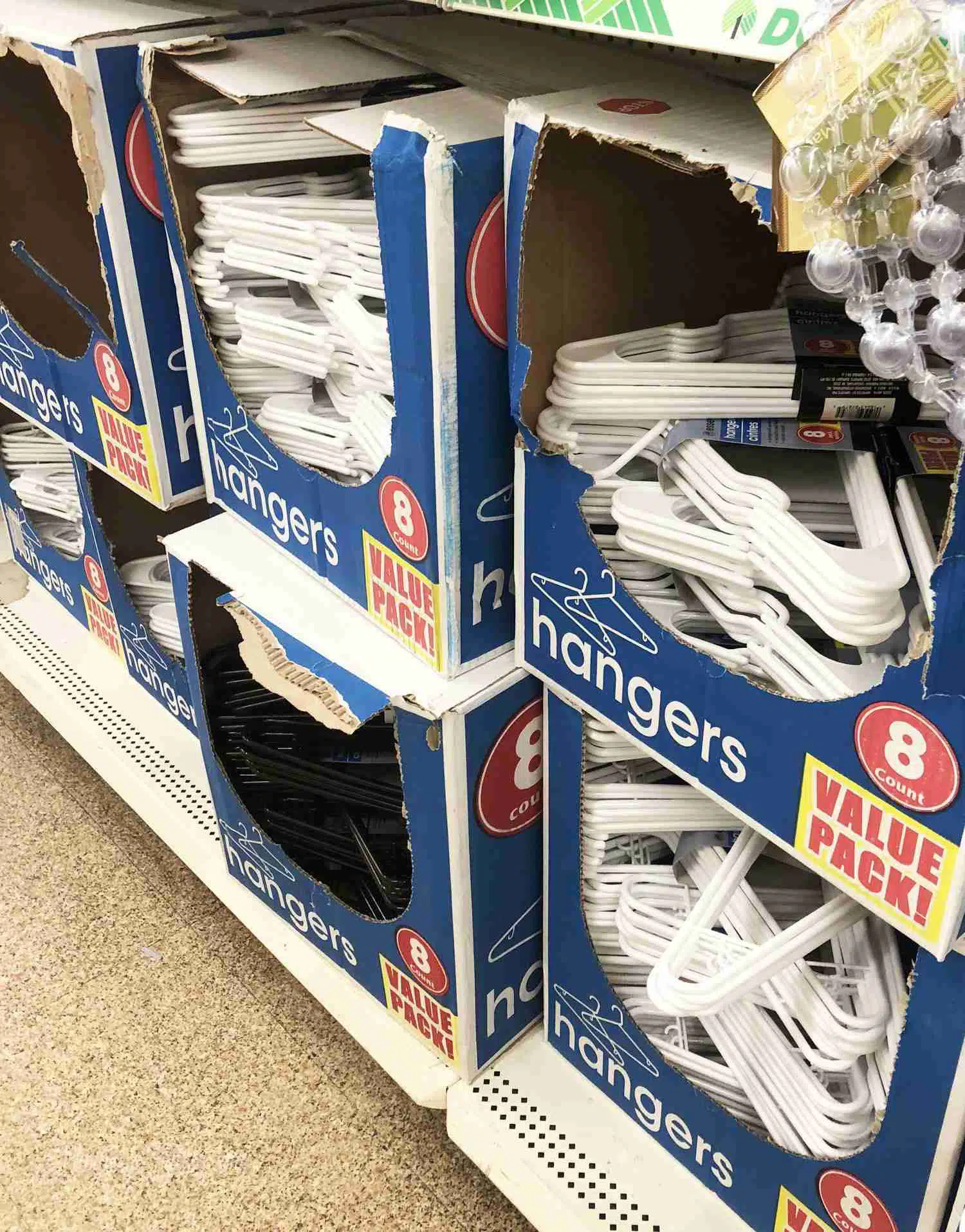 boxes of plastic hangers at a store.