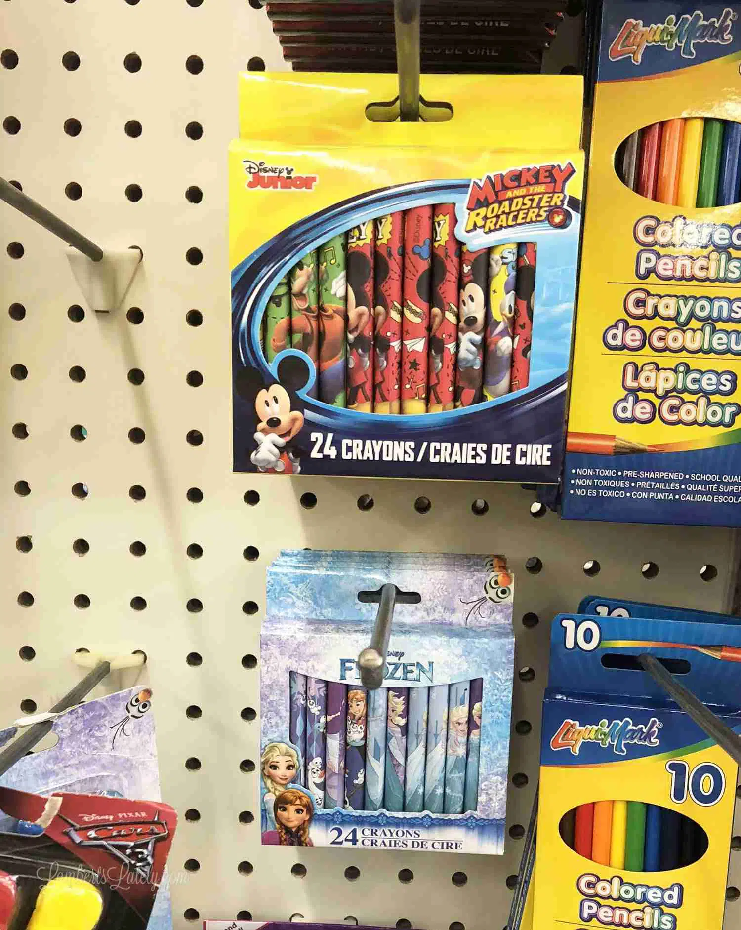 crayons hanging on a shelf at dollar tree.