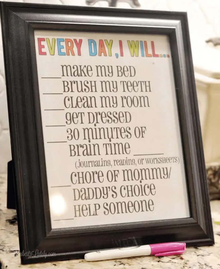 chore chart in a black frame.