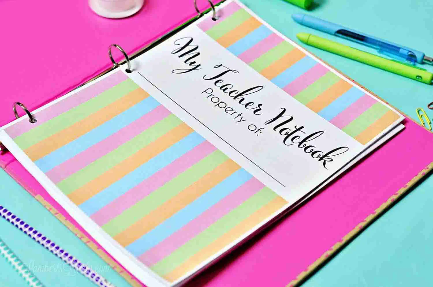 teacher planner in a pink notebook
