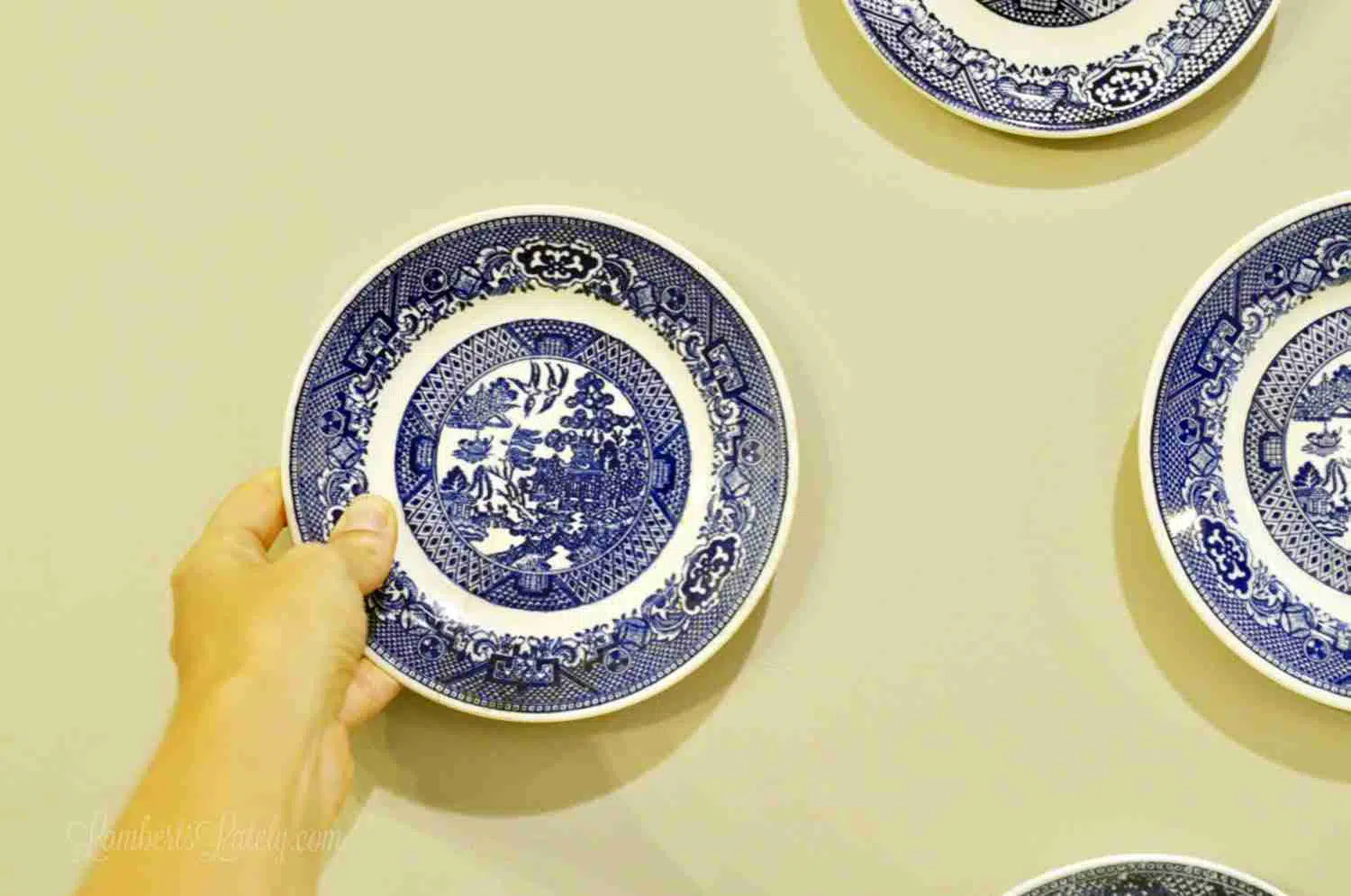 placing a plate on a wall.