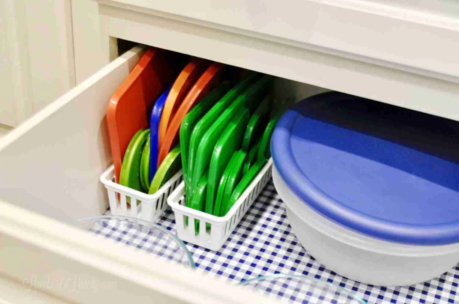 food containers and tops organized in a drawer.