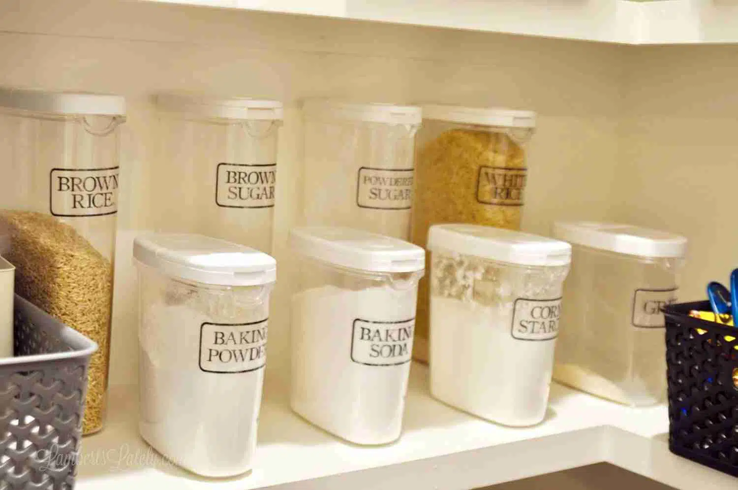 labeled pantry canisters in a line.