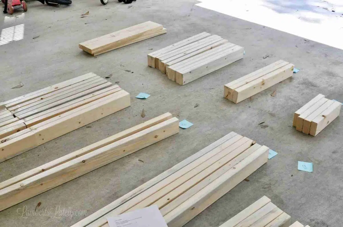 pieces of wood organized by size on a garage floor