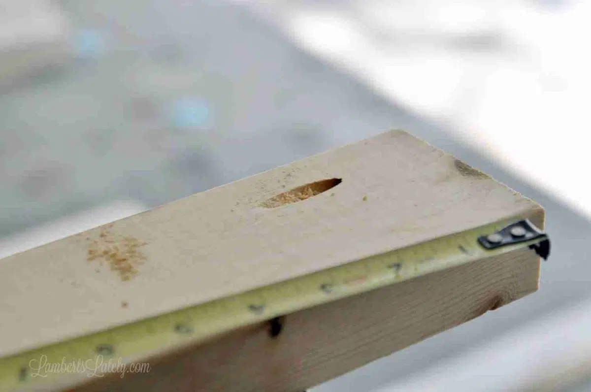 measuring a 2x4 with a pocket hole.