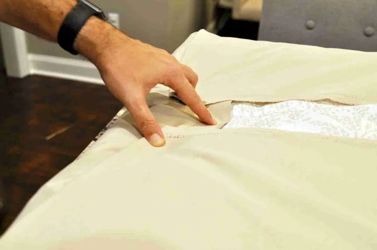 putting together fabric on a mattress cover.