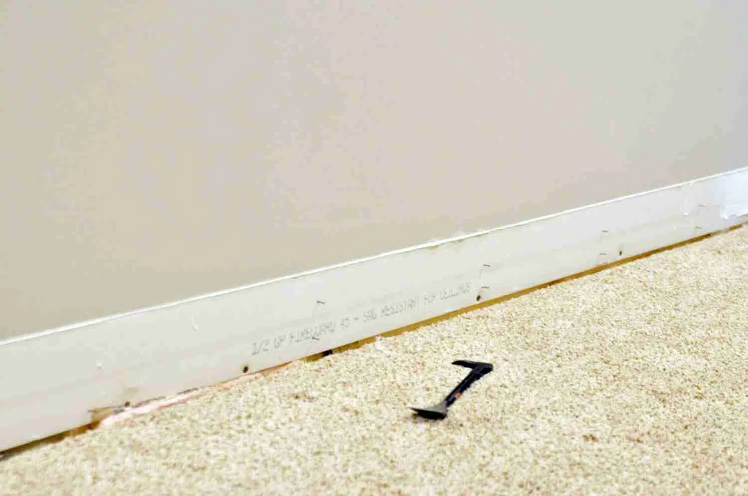 baseboards taken off of a wall.