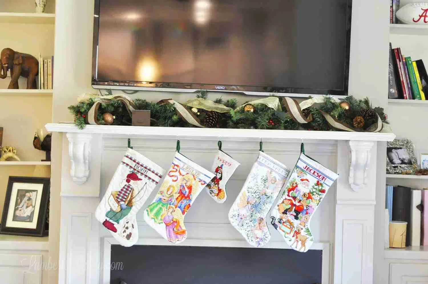 mantle with garland and stockings, tv above.