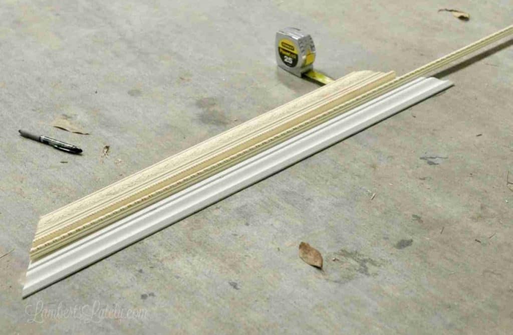 measuring smaller pieces of molding against large piece.