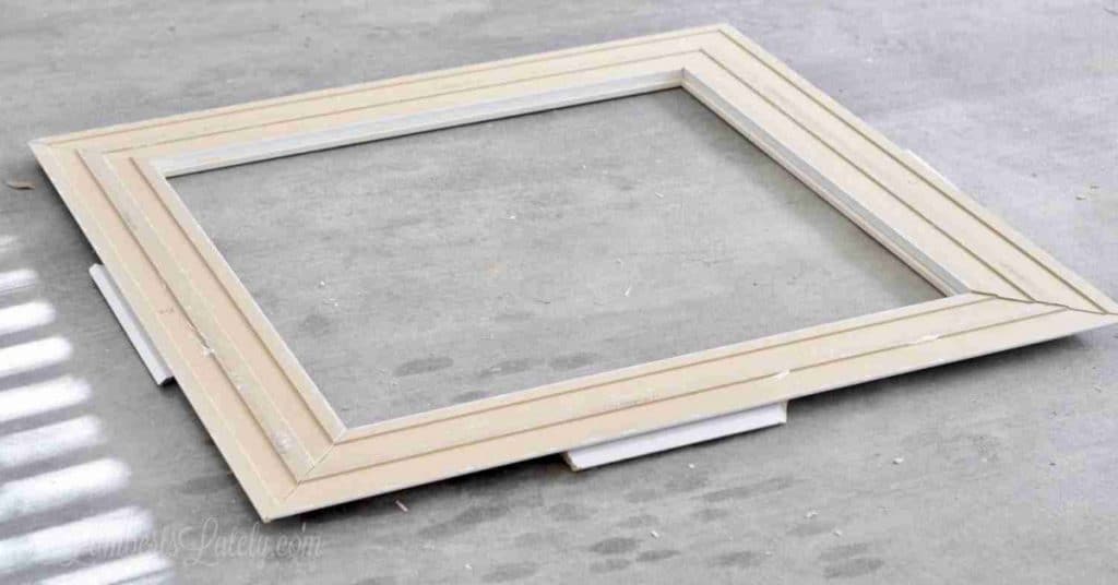 frame laying upside down on garage floor.