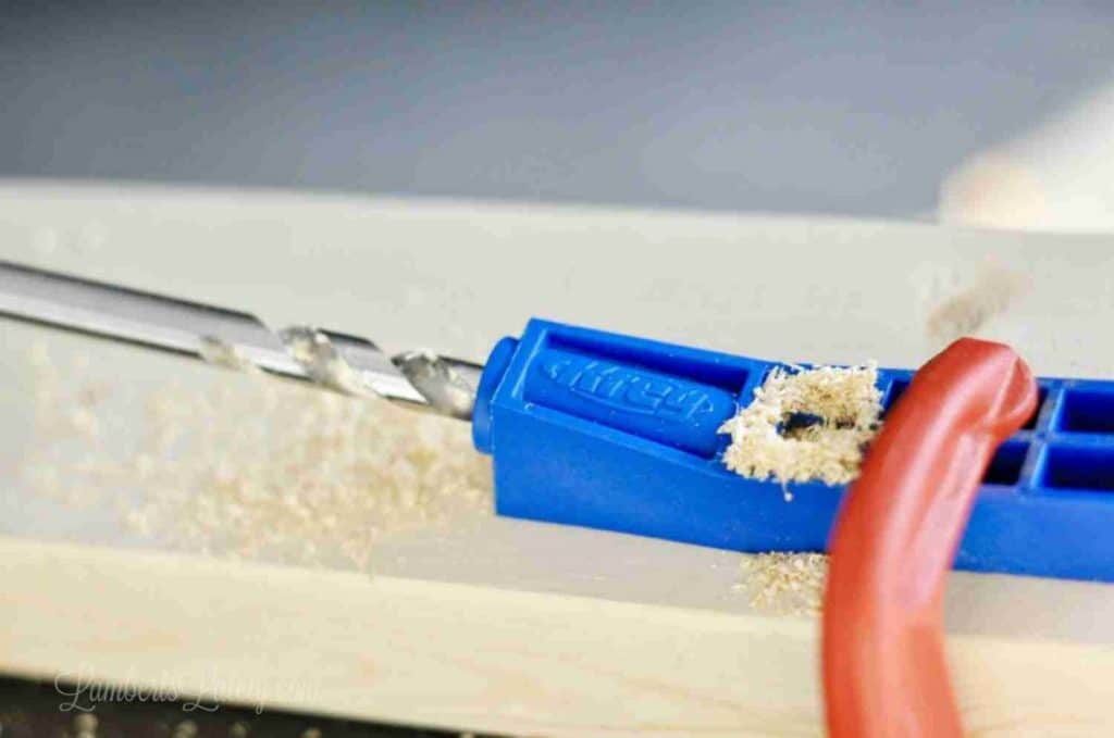 using a jig to drill a pocket hole.