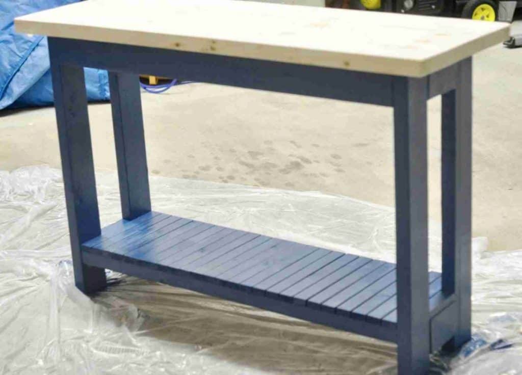 table legs painted blue, wood top not stained.