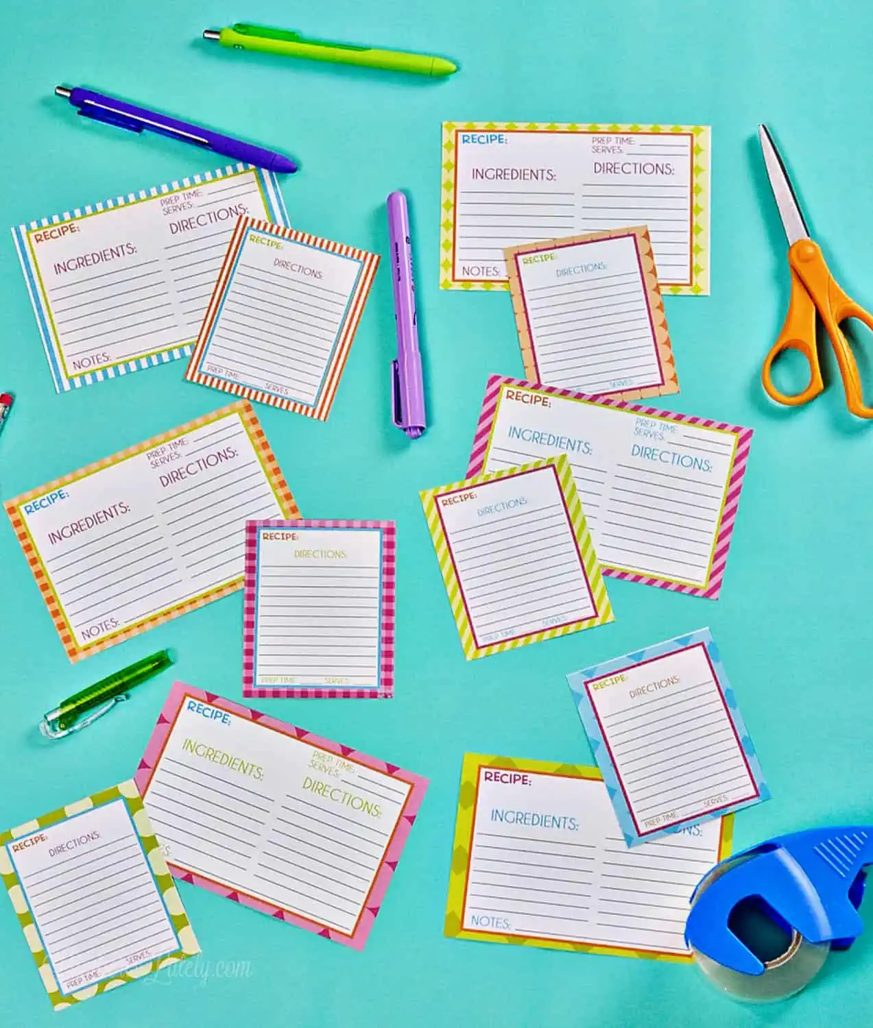 recipe card printables and office supplies on a blue background.