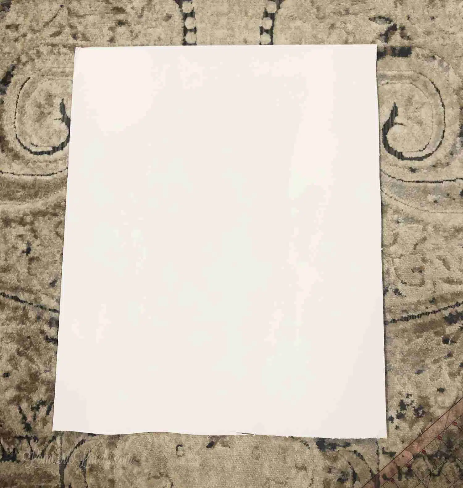 rectangular piece of cloth on a floor.