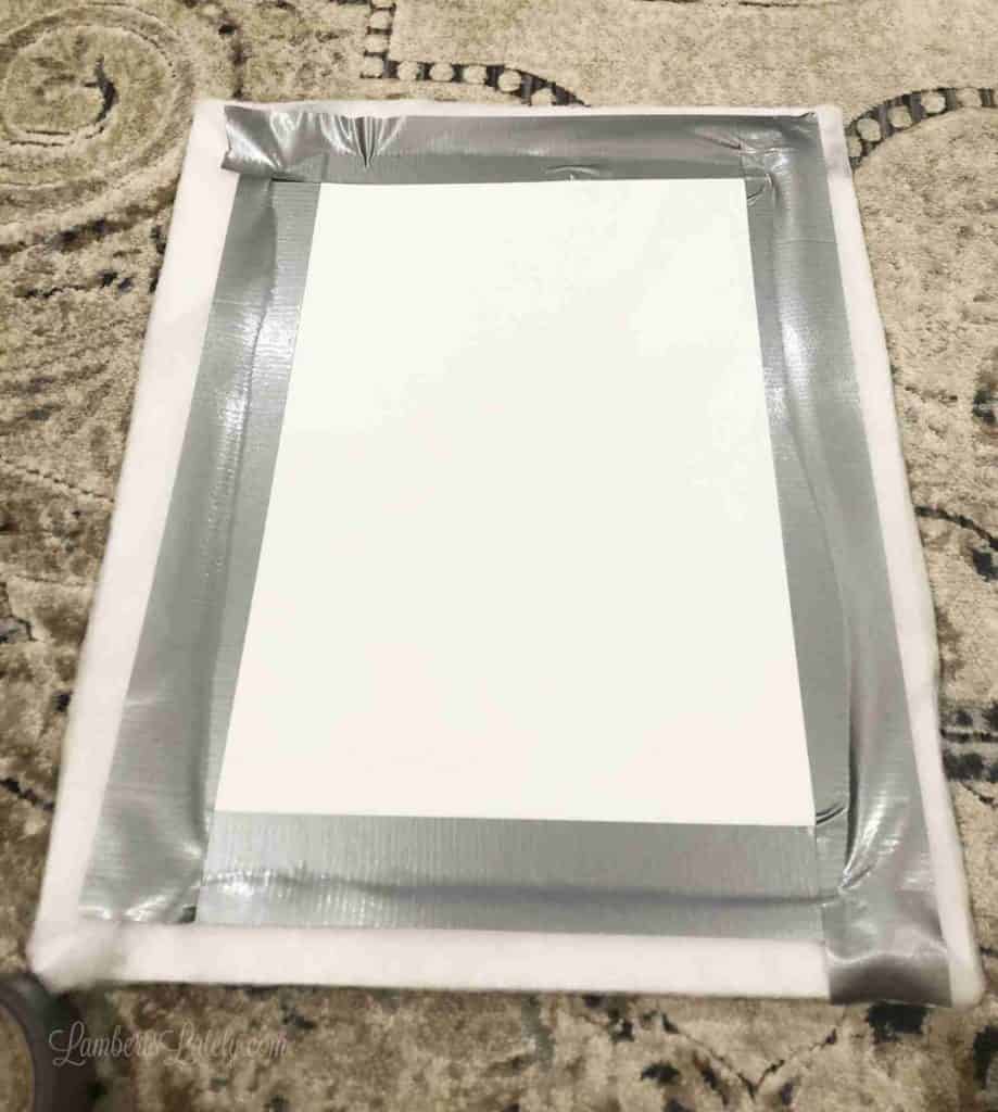 fabric duct taped onto a frame.