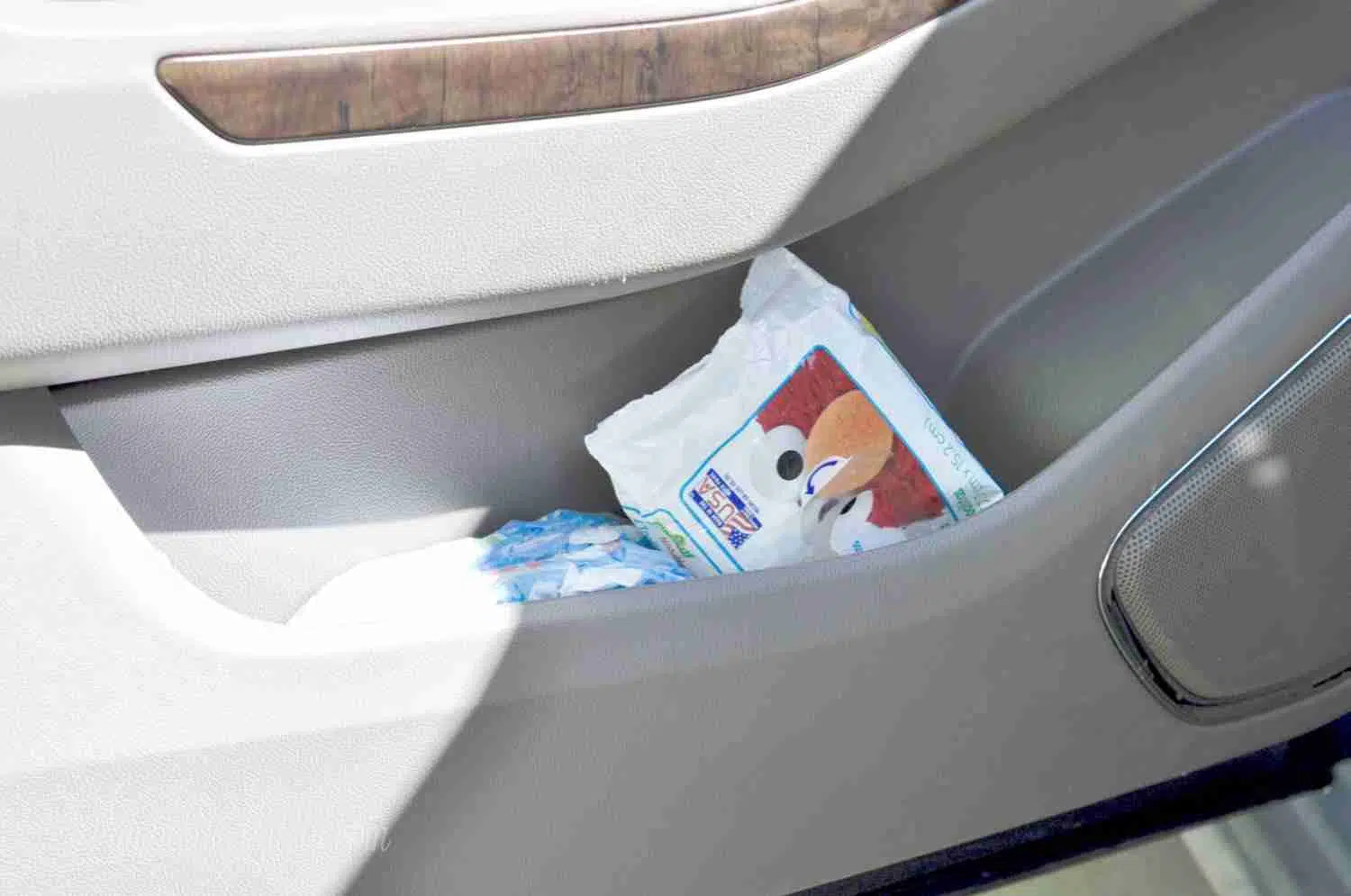 pack of wet wipes in door storage in a car.