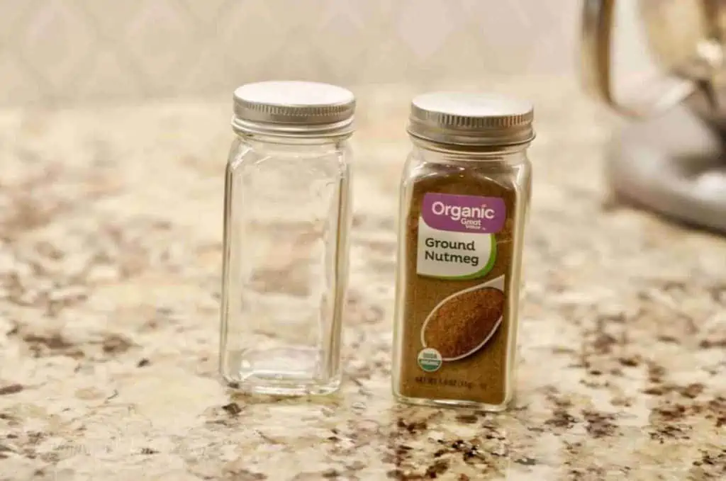 empty glass jar next to a matching full glass jar from walmart.