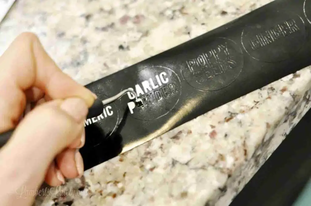 weeding black cut vinyl with a pick.