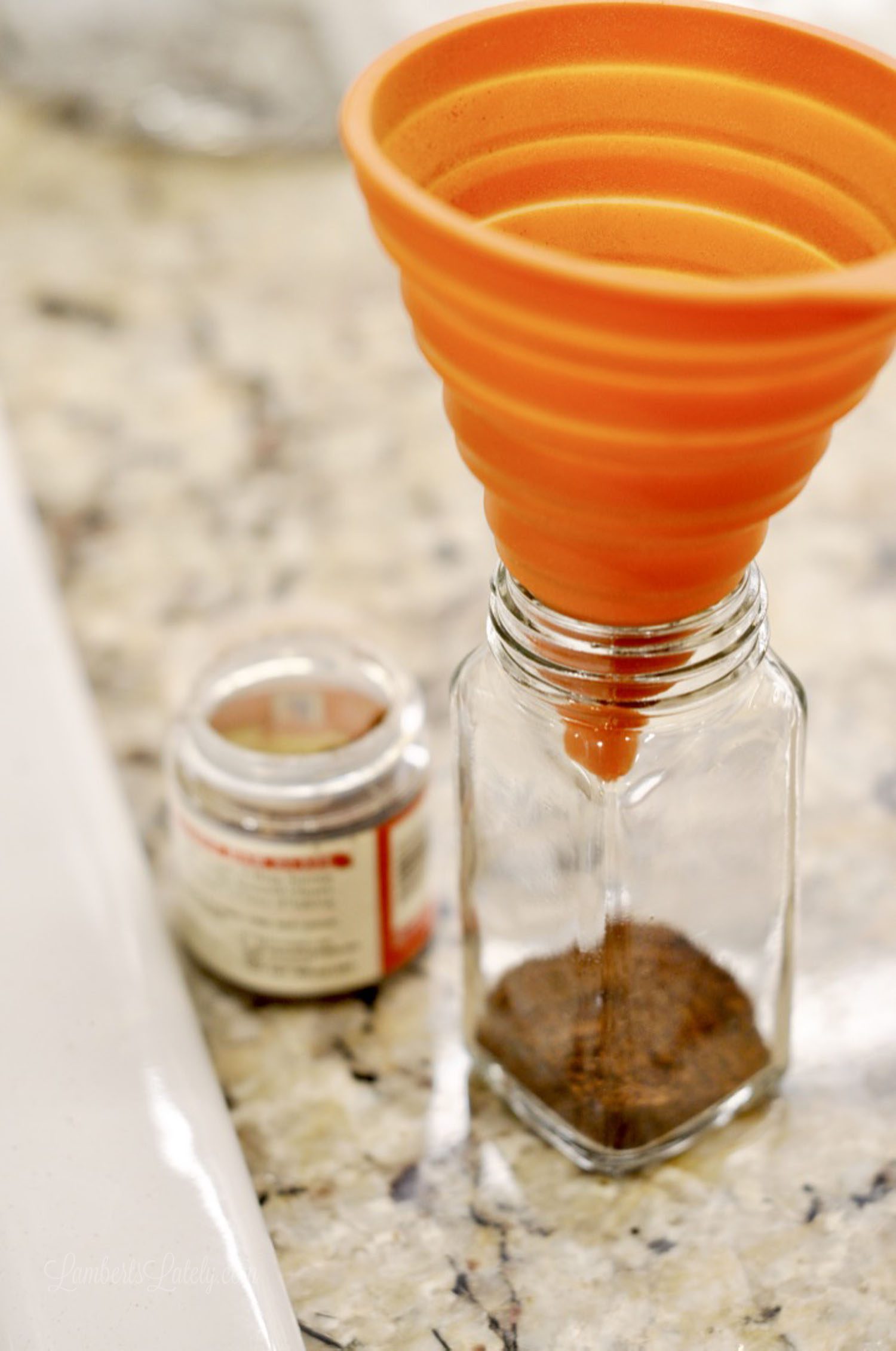 funnel in a glass spice jar.