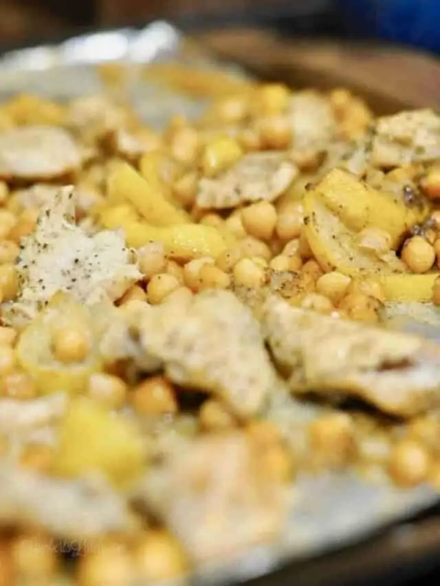 lemon, chickpeas, and chicken on a sheet pan.