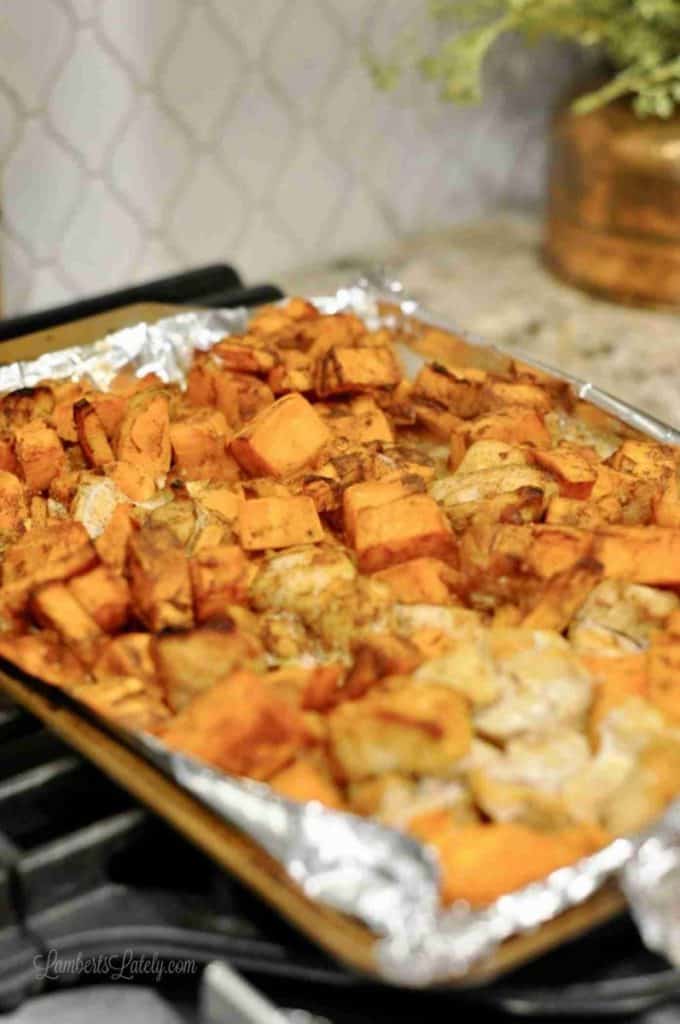barbecue chicken and sweet potatoes on a sheet pan.